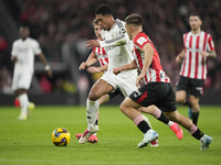 Jude Bellingham central midfield of Real Madrid and England surrounded by Athletic players during the La Liga match between Athletic Club an...