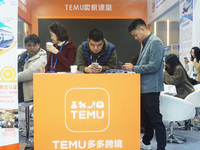 Visitors visit the stand of Pinduoduo's Temu at a fashion exhibition in Hangzhou, Zhejiang province, China, on December 5, 2024. (