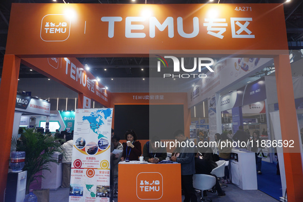 Visitors visit the stand of Pinduoduo's Temu at a fashion exhibition in Hangzhou, Zhejiang province, China, on December 5, 2024. 