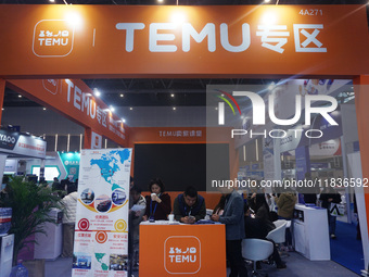 Visitors visit the stand of Pinduoduo's Temu at a fashion exhibition in Hangzhou, Zhejiang province, China, on December 5, 2024. (