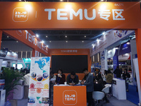 Visitors visit the stand of Pinduoduo's Temu at a fashion exhibition in Hangzhou, Zhejiang province, China, on December 5, 2024. (