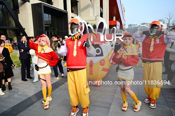 Products from the collaboration between the game Zenless Zone Zero and McDonald's parade through the streets in Shanghai, China, on December...