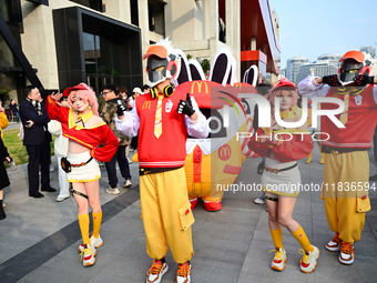 Products from the collaboration between the game Zenless Zone Zero and McDonald's parade through the streets in Shanghai, China, on December...