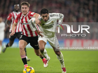 Jude Bellingham central midfield of Real Madrid and England and Mikel Jauregizar central midfield of Athletic Club and Spain compete for the...