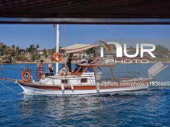 A ship with tourists travels along the Mediterranean coast in Side, Turkey, on November 7, 2024 (