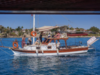 A ship with tourists travels along the Mediterranean coast in Side, Turkey, on November 7, 2024 (