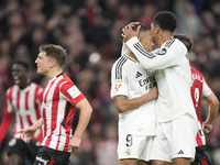 Jude Bellingham central midfield of Real Madrid and England comforts to Kylian Mbappe centre-forward of Real Madrid and France after failed...