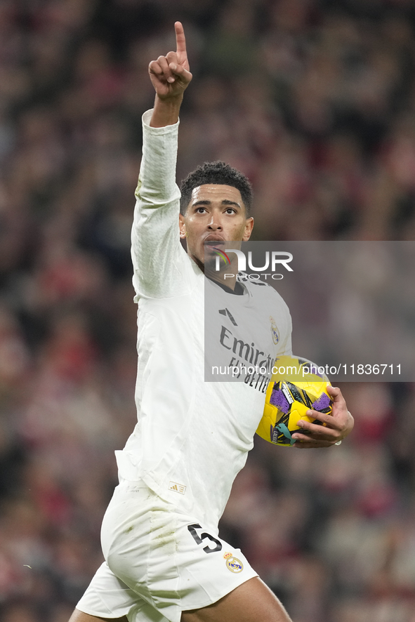 Jude Bellingham central midfield of Real Madrid and England celebrates after scoring his sides first goal during the La Liga match between A...