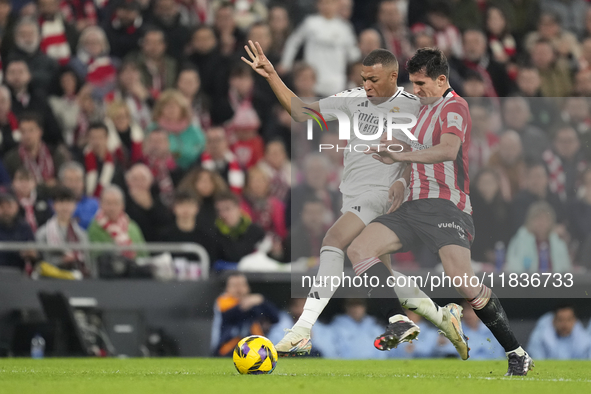 Kylian Mbappe centre-forward of Real Madrid and France and Dani Vivian centre-back of Athletic Club and Spain compete for the ball during th...