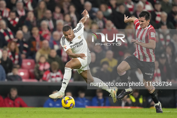 Kylian Mbappe centre-forward of Real Madrid and France and Dani Vivian centre-back of Athletic Club and Spain compete for the ball during th...