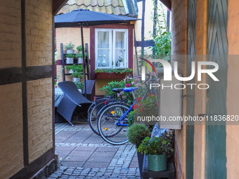 Bicycles park near the house in Ystad, Sweden, on August 4, 2024. (