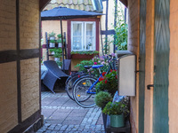 Bicycles park near the house in Ystad, Sweden, on August 4, 2024. (