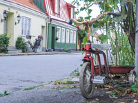 An old town street with bicycles parked in front of buildings is seen in Ystad, Sweden, on August 4, 2024. (