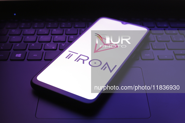 The TRON logo appears on the screen of a smartphone in Reno, United States, on December 5, 2024. 