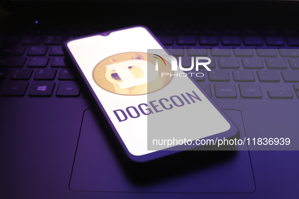 The Dogecoin logo appears on the screen of a smartphone in Reno, United States, on December 5, 2024. 