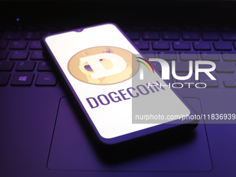 The Dogecoin logo appears on the screen of a smartphone in Reno, United States, on December 5, 2024. (