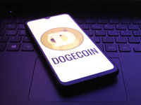 The Dogecoin logo appears on the screen of a smartphone in Reno, United States, on December 5, 2024. (