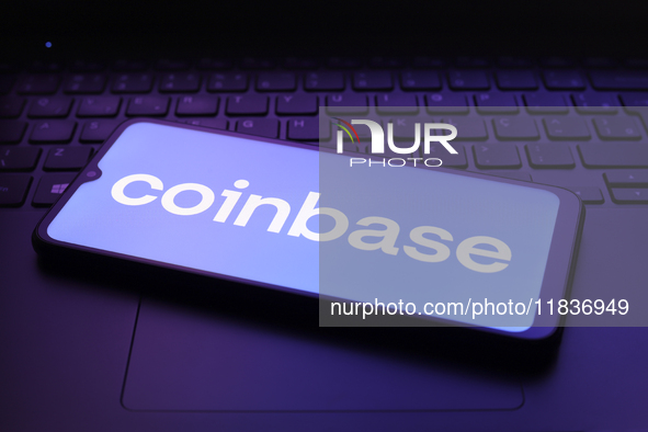 The Coinbase logo appears on the screen of a smartphone in Reno, United States, on December 5, 2024. 