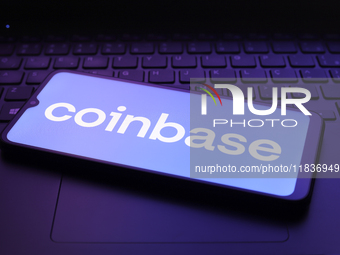 The Coinbase logo appears on the screen of a smartphone in Reno, United States, on December 5, 2024. (