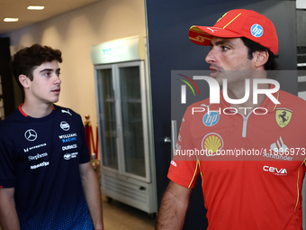 Franco Colapinto of Williams and Carlos Sainz of Ferrari ahead of the Formula 1 Austrian Grand Prix at Yas Marina Circuit in Abu Dhabi, Unit...