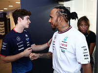 Franco Colapinto of Williams and Lewis Hamilton of Mercedes ahead of the Formula 1 Austrian Grand Prix at Yas Marina Circuit in Abu Dhabi, U...