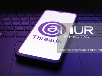 The Threads app logo appears on the screen of a smartphone in Reno, United States, on December 5, 2024. (