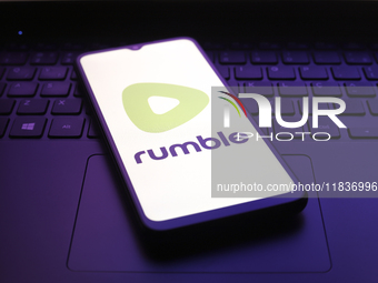 The Rumble app logo appears on the screen of a smartphone in Reno, United States, on December 5, 2024. (