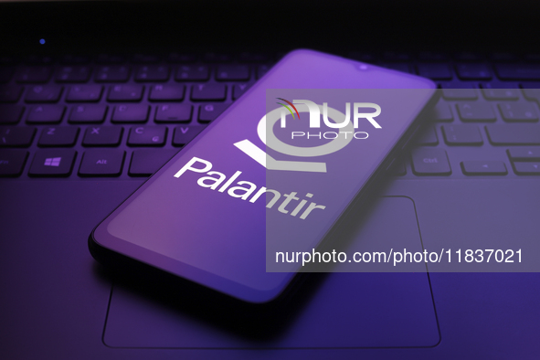 The Palantir Technologies logo appears on the screen of a smartphone in Reno, United States, on December 5, 2024. 