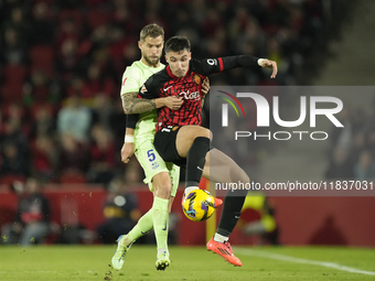 Inigo Martinez centre-back of Barcelona and Spain and Valery Fernandez right winger of Mallorca and Spain compete for the ball during the La...