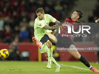 Inigo Martinez centre-back of Barcelona and Spain and Valery Fernandez right winger of Mallorca and Spain compete for the ball during the La...