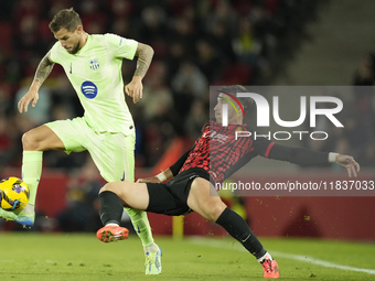 Inigo Martinez centre-back of Barcelona and Spain and Valery Fernandez right winger of Mallorca and Spain compete for the ball during the La...