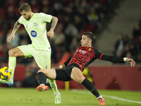 Inigo Martinez centre-back of Barcelona and Spain and Valery Fernandez right winger of Mallorca and Spain compete for the ball during the La...