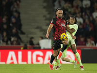 Vedat Muriqi centre-forward of Mallorca and Kosovo and Jules Kounde centre-back of Barcelona and France compete for the ball during the La L...