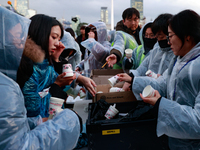 Hundreds of citizens, along with members of the Democratic Party of Korea, gather in front of the National Assembly in Yeouido to participat...