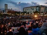 Hundreds of citizens, along with members of the Democratic Party of Korea, gather in front of the National Assembly in Yeouido to participat...