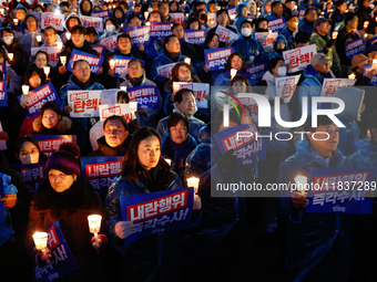 Hundreds of citizens, along with members of the Democratic Party of Korea, gather in front of the National Assembly in Yeouido to participat...