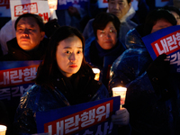 Hundreds of citizens, along with members of the Democratic Party of Korea, gather in front of the National Assembly in Yeouido to participat...