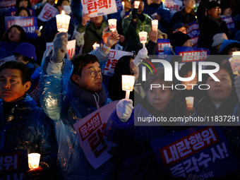 Hundreds of citizens, along with members of the Democratic Party of Korea, gather in front of the National Assembly in Yeouido to participat...