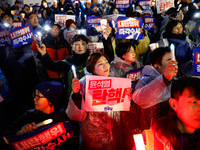 Hundreds of citizens, along with members of the Democratic Party of Korea, gather in front of the National Assembly in Yeouido to participat...