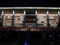 Hundreds of citizens, along with members of the Democratic Party of Korea, gather in front of the National Assembly in Yeouido to participat...