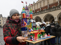 KRAKOW, POLAND - DECEMBER 05:
A contestant presents their handcrafted Nativity Scene at Krakow's Main Square during the 82nd Nativity Scene...