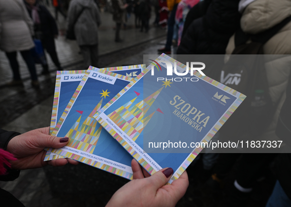 KRAKOW, POLAND - DECEMBER 05:
Official programme for the 82nd Nativity Scene Contest distributed in Krakow's Market Square, on December 5, 2...