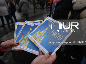 KRAKOW, POLAND - DECEMBER 05:
Official programme for the 82nd Nativity Scene Contest distributed in Krakow's Market Square, on December 5, 2...