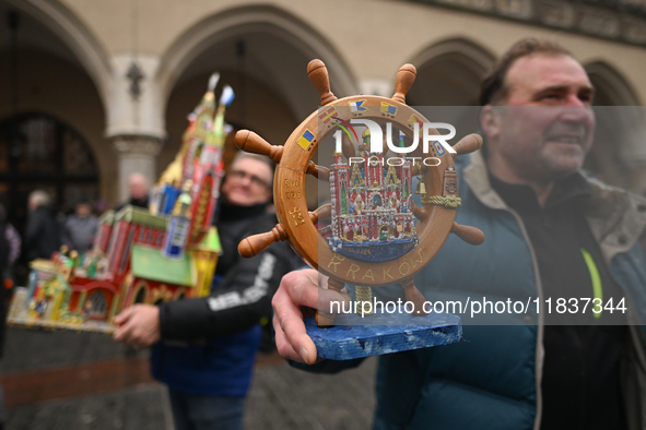 KRAKOW, POLAND - DECEMBER 05:
A contestant presents their handcrafted Nativity Scene at Krakow's Main Square during the 82nd Nativity Scene...