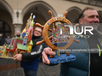 KRAKOW, POLAND - DECEMBER 05:
A contestant presents their handcrafted Nativity Scene at Krakow's Main Square during the 82nd Nativity Scene...