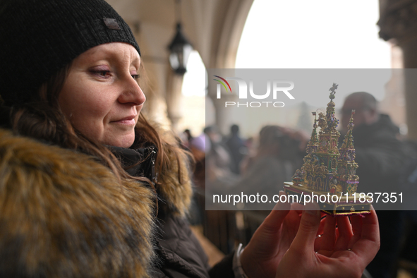 KRAKOW, POLAND - DECEMBER 05:
A contestant presents their handcrafted Nativity Scene at Krakow's Main Square during the 82nd Nativity Scene...