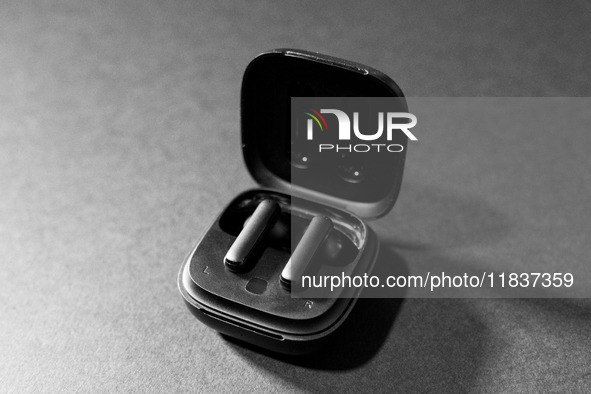 Black wireless headphones sit on a table in Athens, Greece, on December 5, 2024. (Photo Illustration  by Nikolas Kokovlis/NurPhoto)