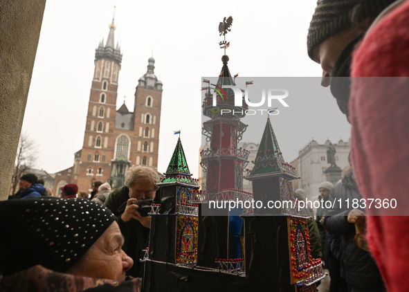 KRAKOW, POLAND - DECEMBER 05:
A contestant presents their handcrafted Nativity Scene at Krakow's Main Square during the 82nd Nativity Scene...