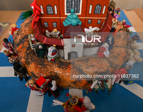 KRAKOW, POLAND - DECEMBER 05:
A contestant presents their handcrafted Nativity Scene at Krakow's Main Square during the 82nd Nativity Scene...