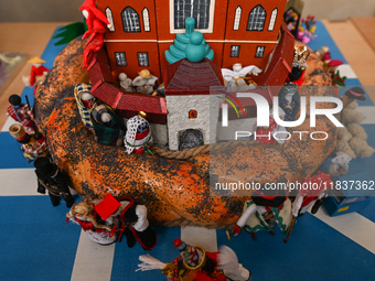 KRAKOW, POLAND - DECEMBER 05:
A contestant presents their handcrafted Nativity Scene at Krakow's Main Square during the 82nd Nativity Scene...